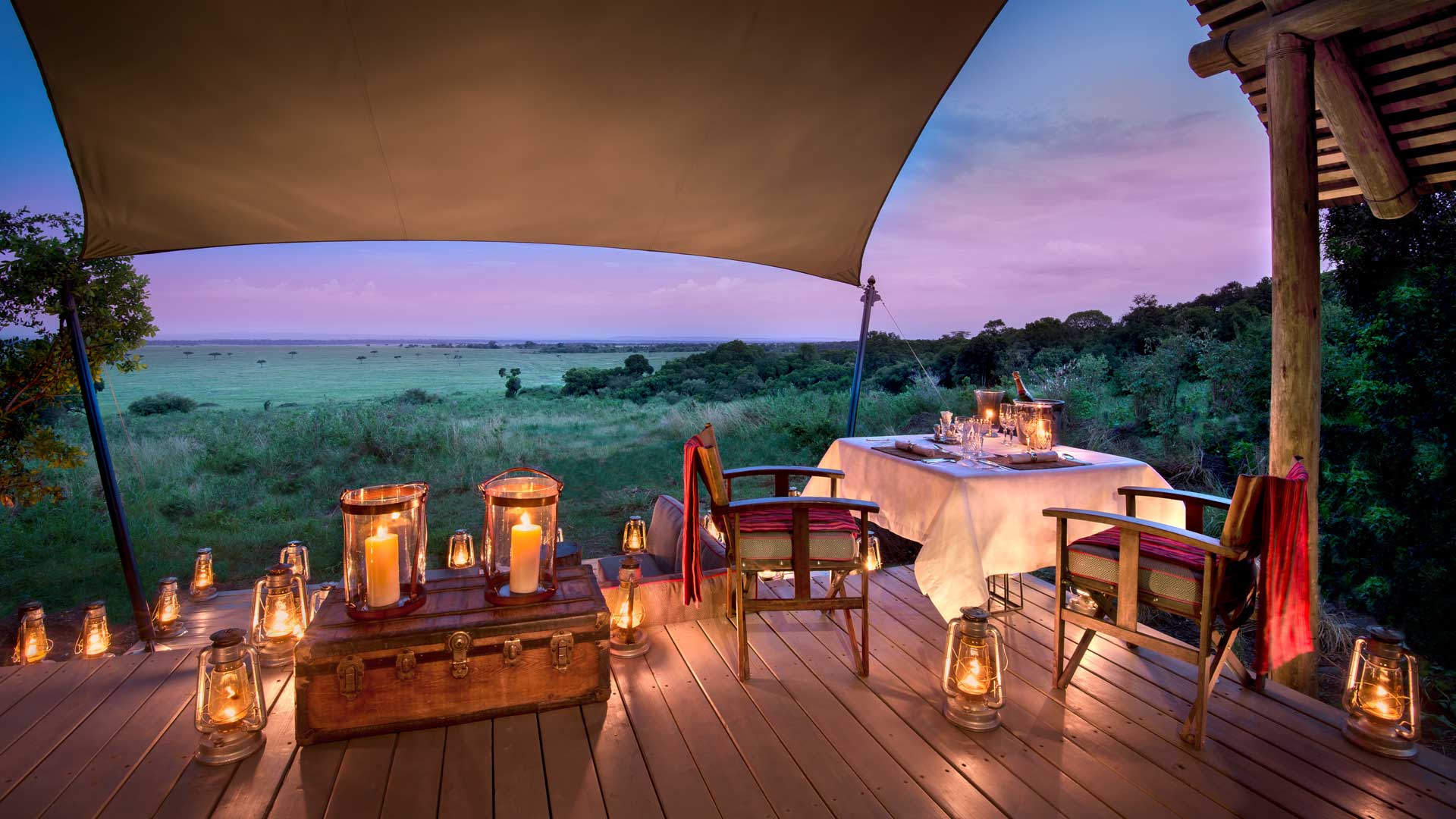 Lantern-lit dining overlooking the Masai Mara