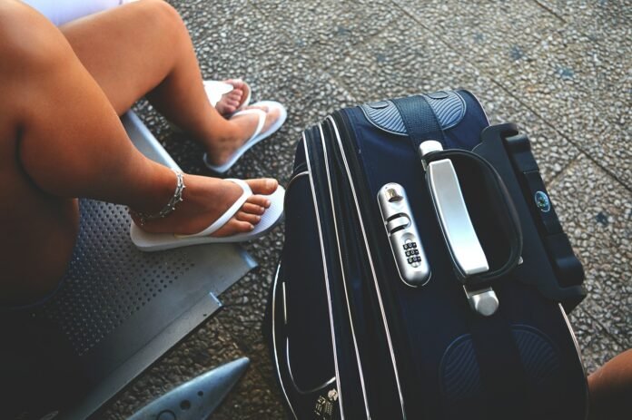 a woman with travel luggage