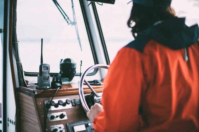 a man traveling with on a boat with a walkie talkie