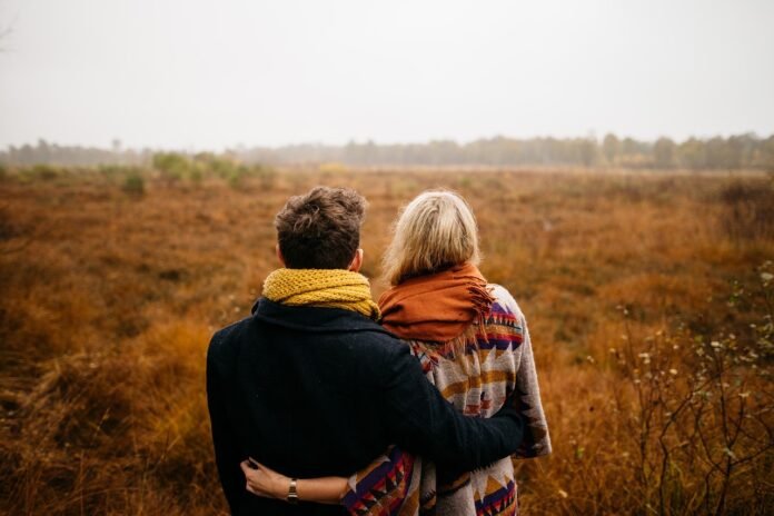 a man and woman wearing safari clothing Man and woman wearing safari clothing