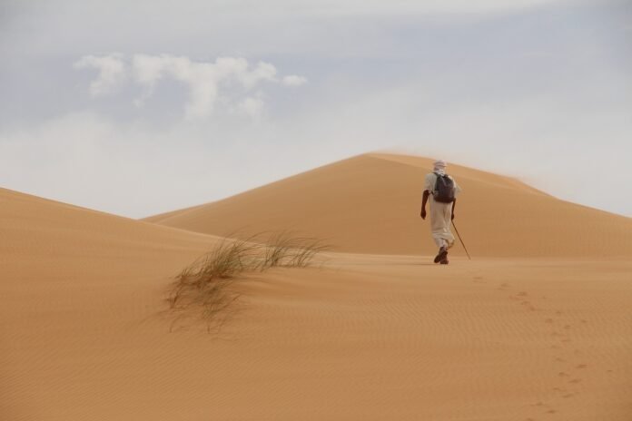 desert traveler wearing sandals traveler wearing sandals in the desert