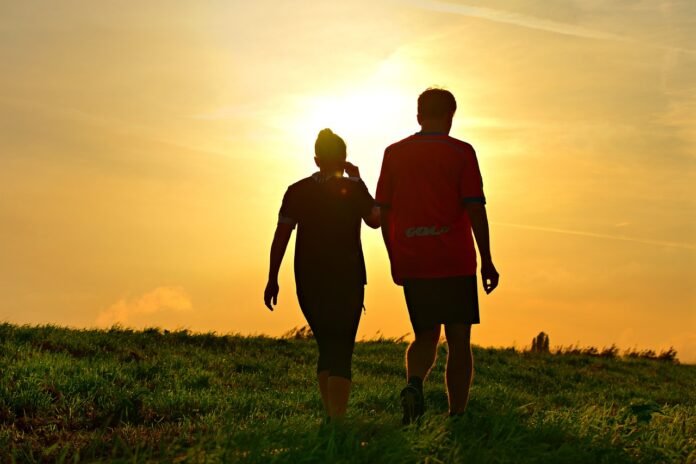 a couple walking with walking shoes