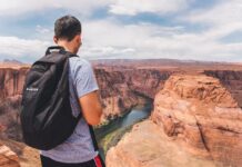 Best Travel Camera For Backpacking A backpacker traveling.