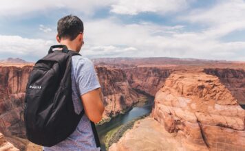 Best Travel Camera For Backpacking A backpacker traveling.